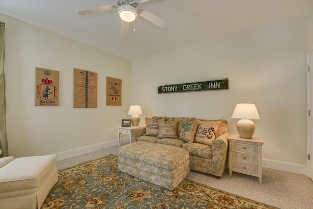 carpeted living room featuring ceiling fan