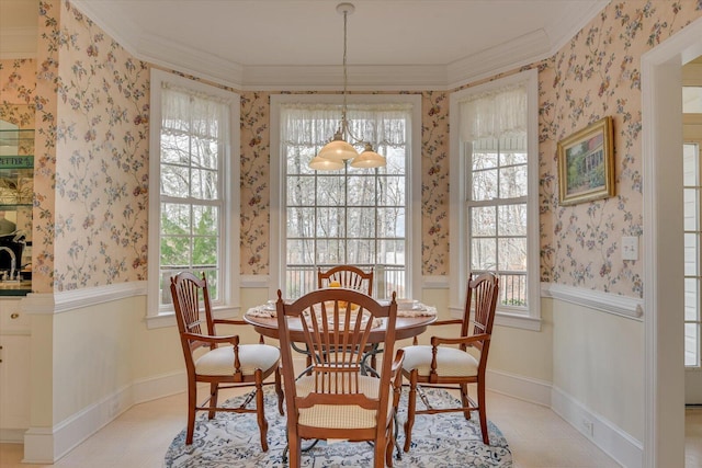 dining area featuring crown molding