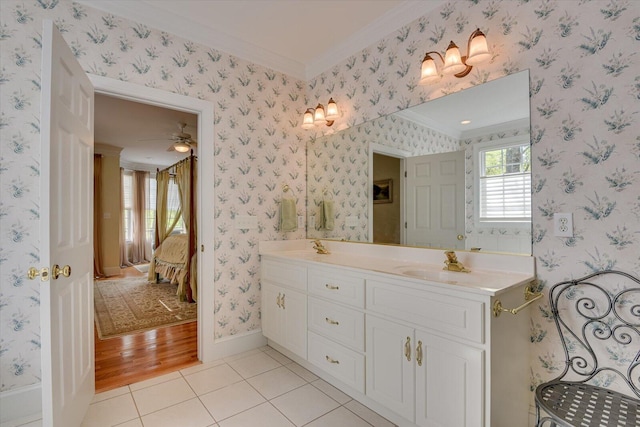 bathroom with hardwood / wood-style flooring, vanity, ceiling fan, and crown molding