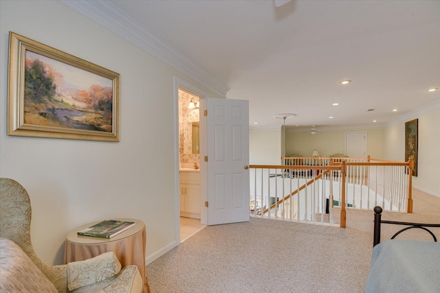 hall with crown molding and light carpet