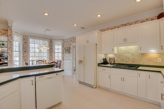 kitchen with white appliances, white cabinetry, hanging light fixtures, and crown molding