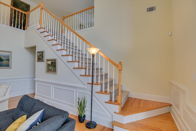 stairway featuring wood-type flooring