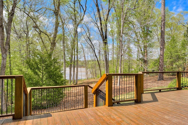 wooden deck featuring a water view