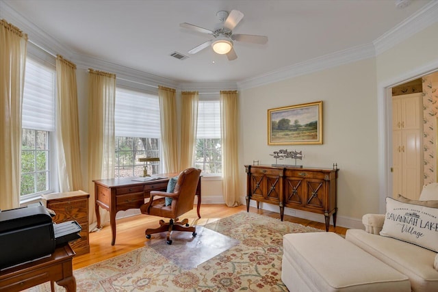 office with crown molding, light hardwood / wood-style flooring, and ceiling fan