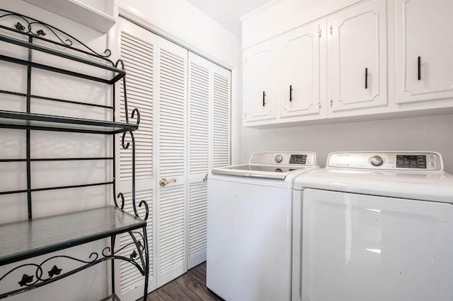 clothes washing area with cabinets, independent washer and dryer, and dark hardwood / wood-style floors