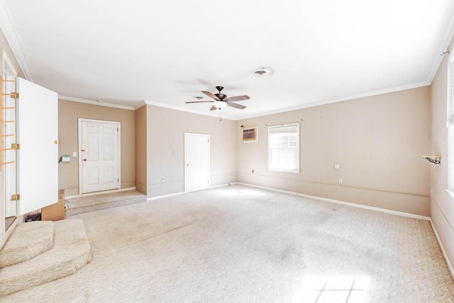 spare room with light colored carpet, ceiling fan, and crown molding