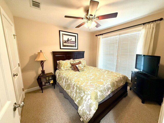384 Connor Cir, Evans, GA 30809 - bedroom with light carpet, a ceiling fan, and baseboards