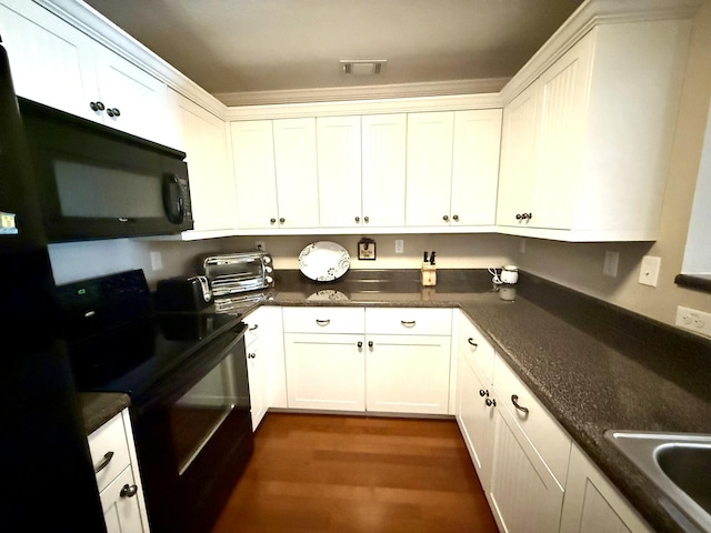 384 Connor Cir, Evans, GA 30809 - kitchen with black appliances, dark wood-type flooring, white cabinetry, and a sink
