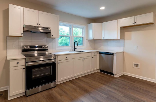 2011 Kennedy Dr, Augusta, GA 30904 - kitchen featuring stainless steel appliances, under cabinet range hood, white cabinets, dark wood finished floors, and recessed lighting