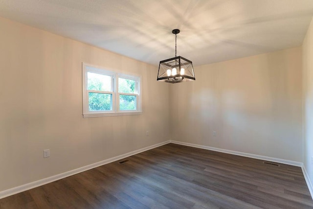 2011 Kennedy Dr, Augusta, GA 30904 - unfurnished room featuring a chandelier and dark wood-type flooring