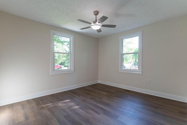 2011 Kennedy Dr, Augusta, GA 30904 - spare room featuring healthy amount of natural light, dark wood-type flooring, a textured ceiling, and ceiling fan