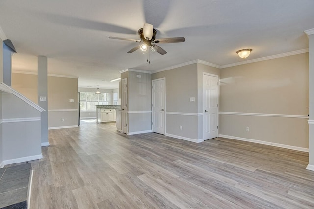 unfurnished living room with light hardwood / wood-style floors, ceiling fan, and crown molding