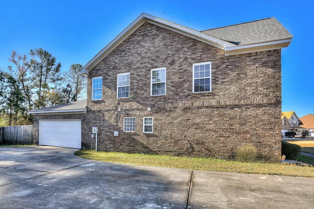 view of property exterior with a garage