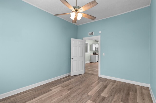 1940 Telfair St, Augusta, GA 30904 - unfurnished room featuring ceiling fan, crown molding, baseboards, and wood finished floors