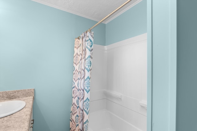 1940 Telfair St, Augusta, GA 30904 - bathroom with ornamental molding, a textured ceiling, vanity, and shower / bath combo with shower curtain