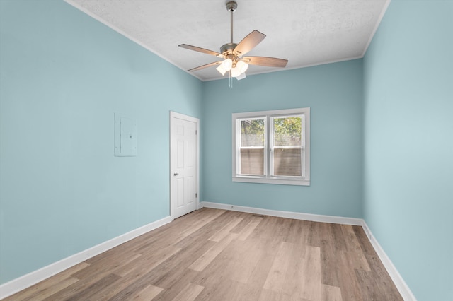 1940 Telfair St, Augusta, GA 30904 - unfurnished room with crown molding, wood finished floors, a textured ceiling, a ceiling fan, and baseboards