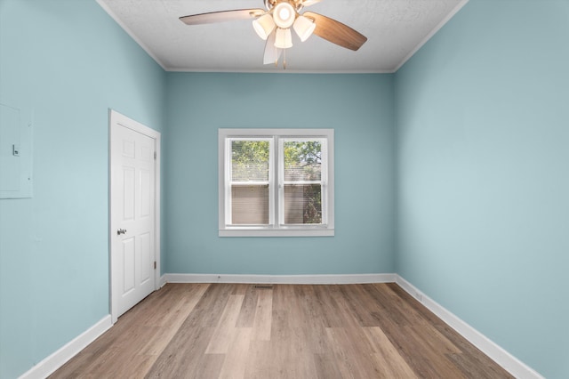 1940 Telfair St, Augusta, GA 30904 - unfurnished room featuring ceiling fan, wood finished floors, crown molding, baseboards, and electric panel