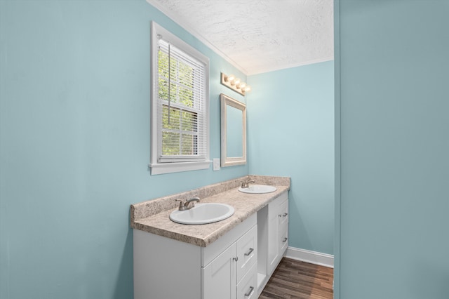 1940 Telfair St, Augusta, GA 30904 - full bath featuring a textured ceiling, crown molding, double vanity, and wood finished floors