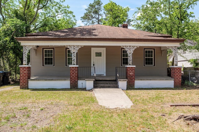 1940 Telfair St, Augusta, GA 30904 - bungalow with a front yard, covered porch, and a chimney