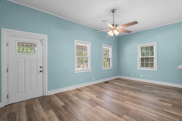 1940 Telfair St, Augusta, GA 30904 - foyer featuring healthy amount of natural light, wood finished floors, and ornamental molding