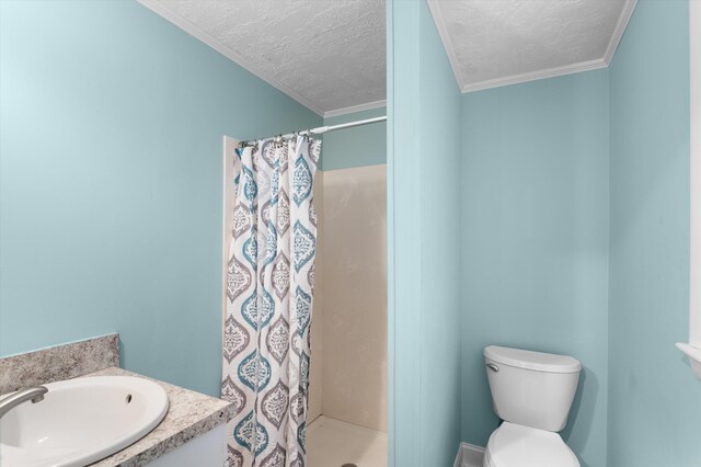 1940 Telfair St, Augusta, GA 30904 - full bathroom with a stall shower, toilet, a textured ceiling, ornamental molding, and vanity