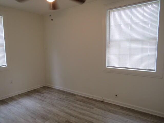 2480 Miles Ave, Augusta, GA 30906 - empty room featuring a ceiling fan, wood finished floors, and healthy amount of natural light