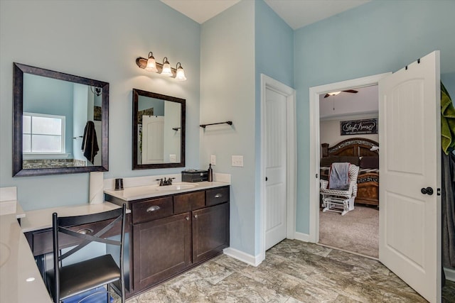 bathroom with ceiling fan and vanity