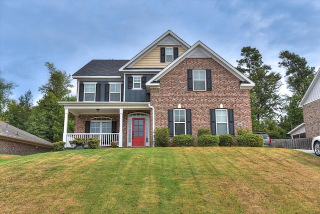 view of front of house featuring a porch and a front lawn