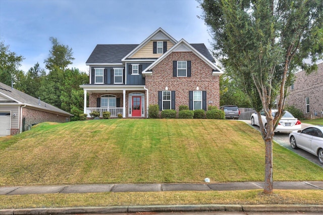 view of front of property with a porch and a front yard