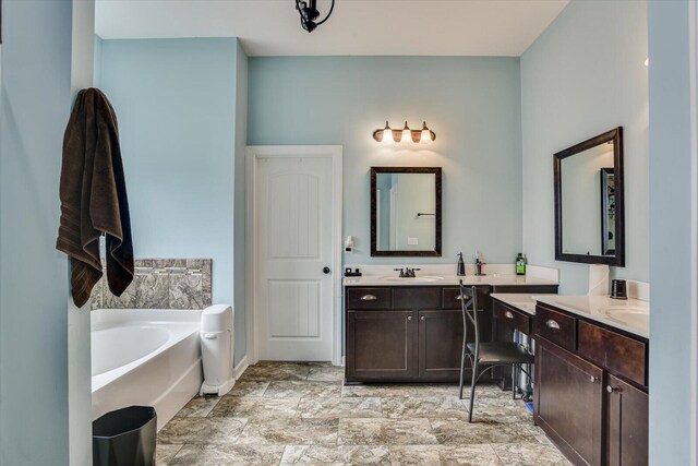 bathroom with a bath and vanity