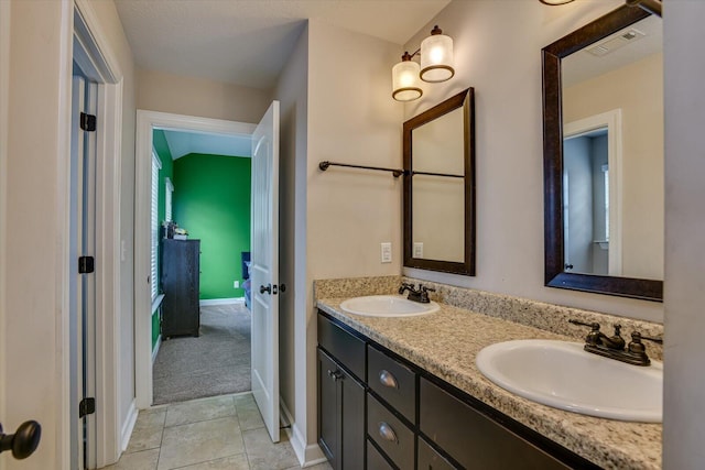 bathroom featuring tile patterned flooring and vanity