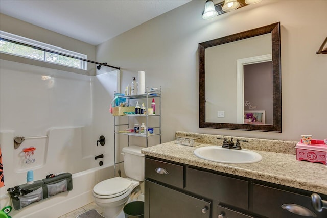 full bathroom featuring tile patterned floors, toilet, vanity, and tub / shower combination