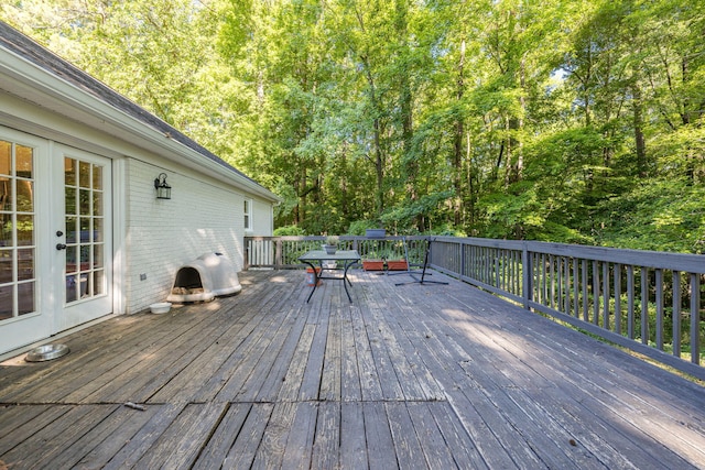 wooden deck featuring french doors