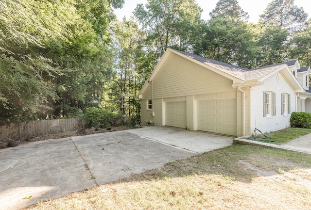 view of side of property featuring a garage