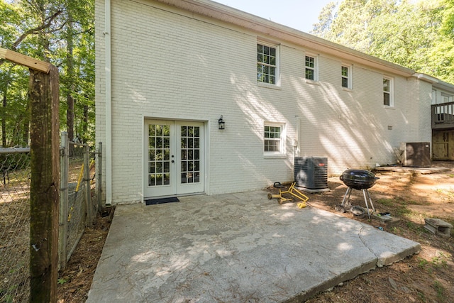 back of house featuring french doors, a patio, and central AC