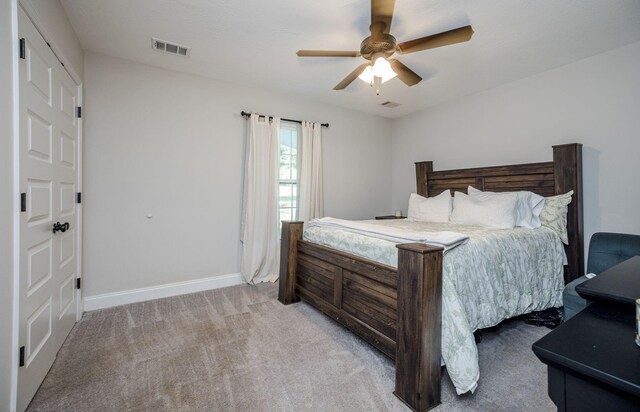 carpeted bedroom with ceiling fan