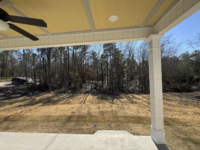 view of yard featuring a ceiling fan