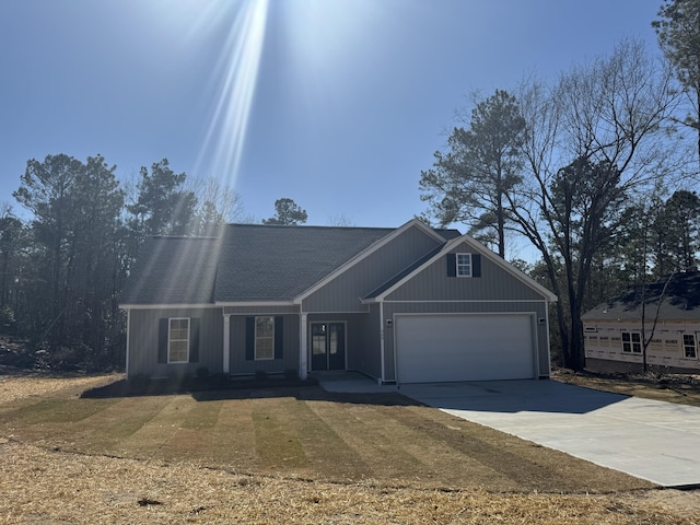 view of front of house featuring driveway and a garage