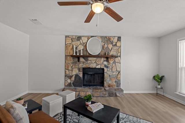 4221 Cap Chat St, Hephzibah, GA 30815 - living area featuring wood finished floors, a ceiling fan, plenty of natural light, and a textured ceiling