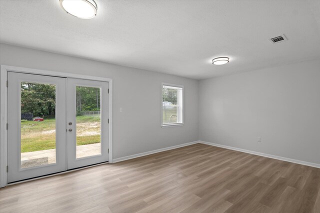4221 Cap Chat St, Hephzibah, GA 30815 - unfurnished room with french doors and light wood-style flooring