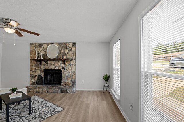 4221 Cap Chat St, Hephzibah, GA 30815 - living room with a ceiling fan, a fireplace, and wood finished floors