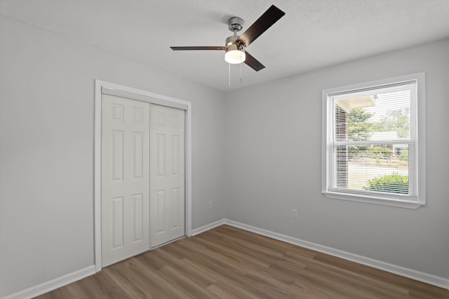 4221 Cap Chat St, Hephzibah, GA 30815 - unfurnished bedroom with wood finished floors, a closet, and a ceiling fan