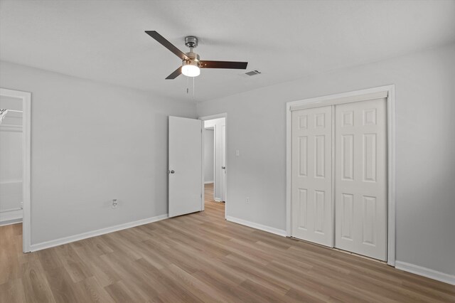 4221 Cap Chat St, Hephzibah, GA 30815 - unfurnished bedroom with a closet, light wood-style floors, and ceiling fan