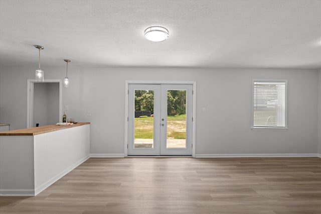 4221 Cap Chat St, Hephzibah, GA 30815 - unfurnished dining area with french doors, healthy amount of natural light, and wood finished floors