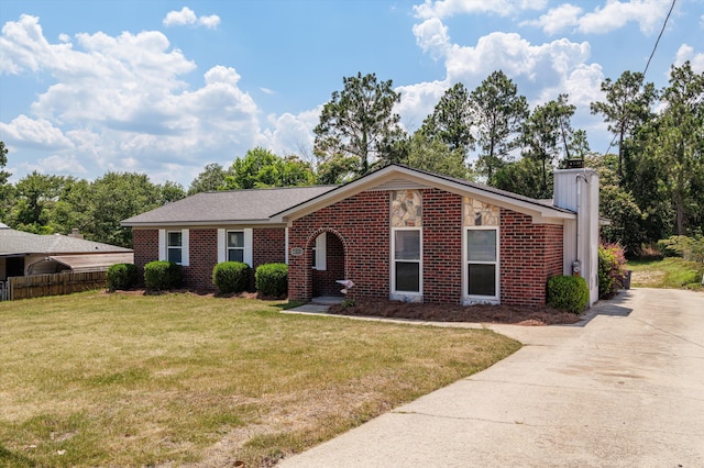 4221 Cap Chat St, Hephzibah, GA 30815 - view of front of house featuring brick siding, a chimney, and concrete driveway