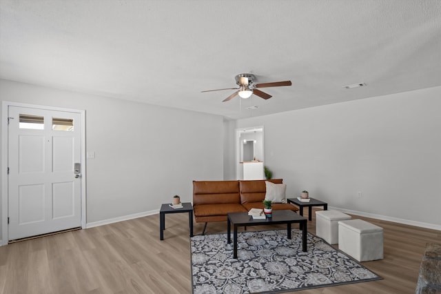 4221 Cap Chat St, Hephzibah, GA 30815 - living room featuring ceiling fan and light wood-style floors