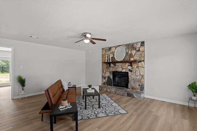 4221 Cap Chat St, Hephzibah, GA 30815 - living area featuring ceiling fan, wood finished floors, and a fireplace
