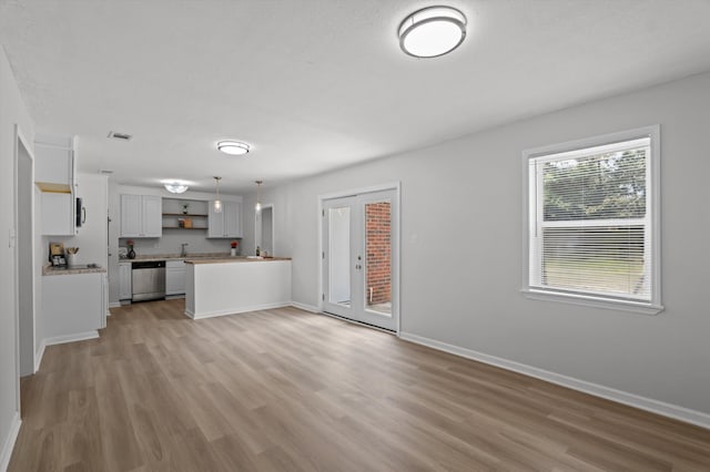 4221 Cap Chat St, Hephzibah, GA 30815 - unfurnished living room with light wood finished floors and baseboards