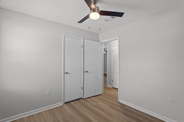 4221 Cap Chat St, Hephzibah, GA 30815 - unfurnished bedroom with wood finished floors and a ceiling fan