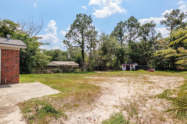 4221 Cap Chat St, Hephzibah, GA 30815 - view of yard featuring a storage unit